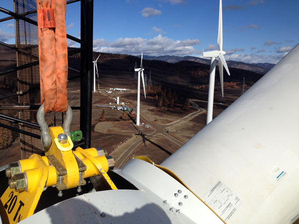 photo of wind turbine blades on a crane
