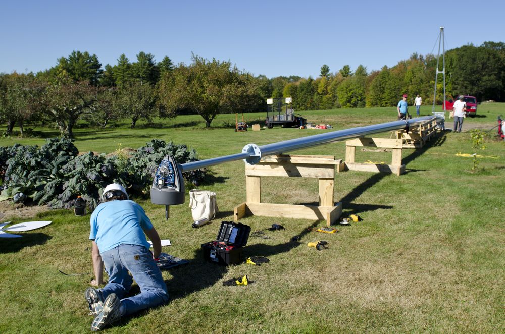 photo of a wind turbine being assembled on the ground