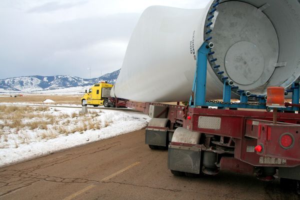photo of wind turbine parts on a semi-trailer truck