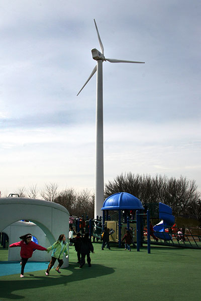 photo of a wind turbine at a school