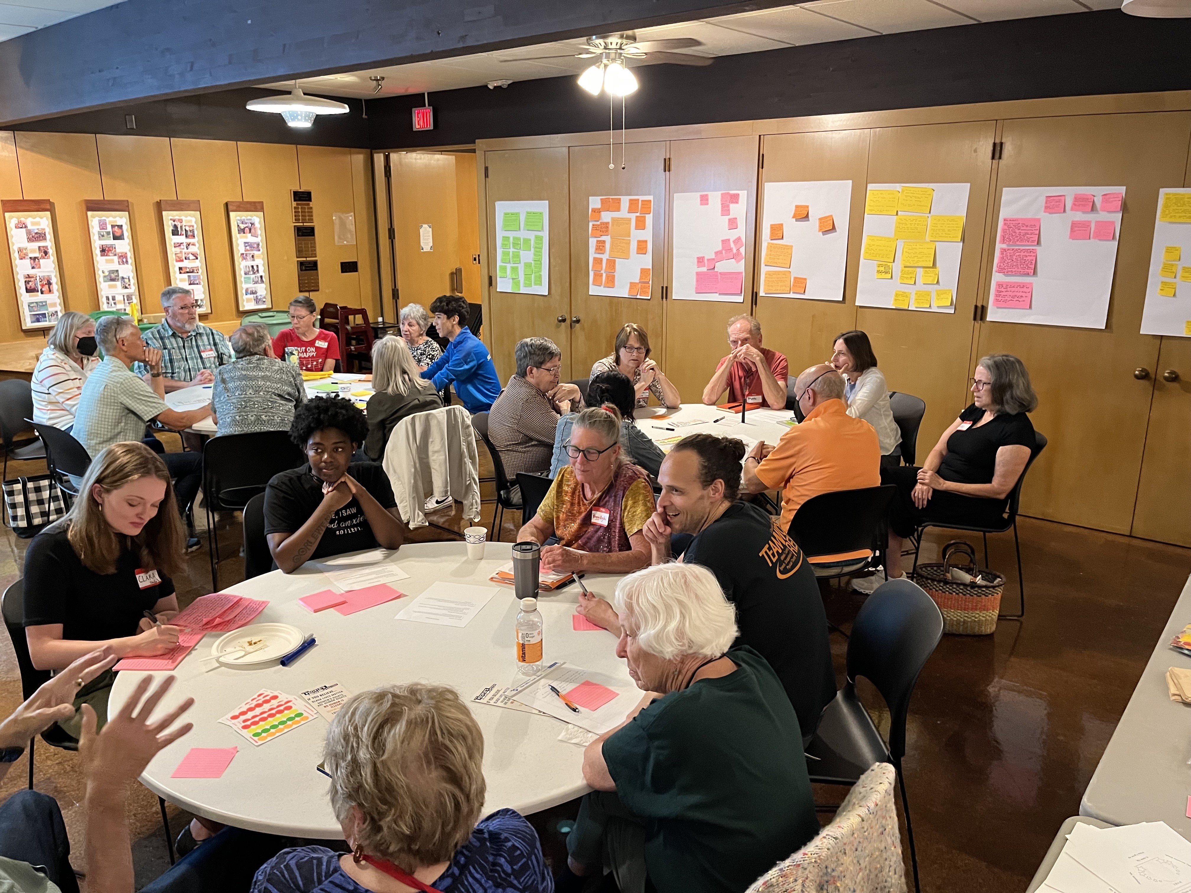 Groups of people sitting at round tables