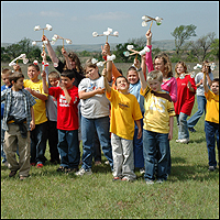 A fourth-grade group from Tipton Elementary School in Tipton, Oklahoma try out their anemometers that were made as one of the hand-on activities during Earth Day festivities at Blue Canyon Wind Farm.